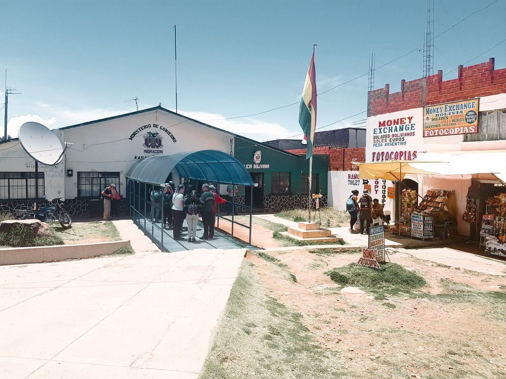The Bolivian migration office is located on the left side of the road through the big arch