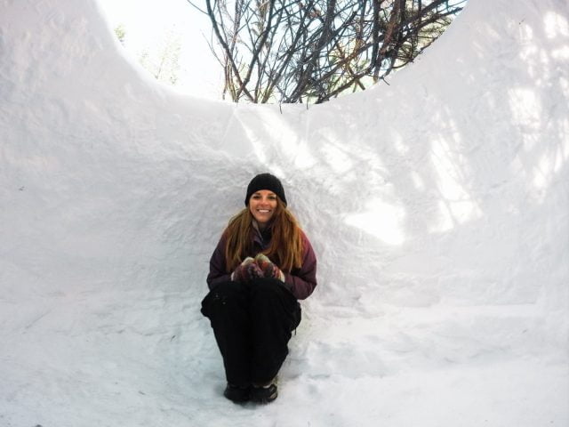 Chilling in our (mostly built) igloo. All it needs is some sleeping bags and homey touches.