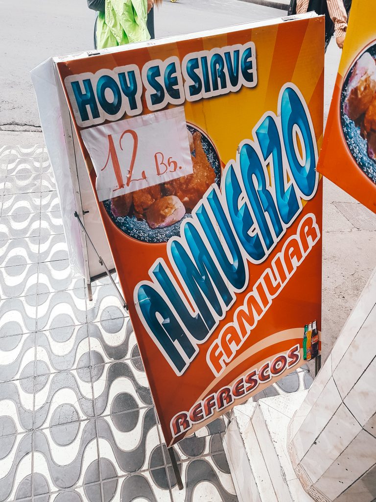 Sign advertising the menu del día, or almuerzo familiar