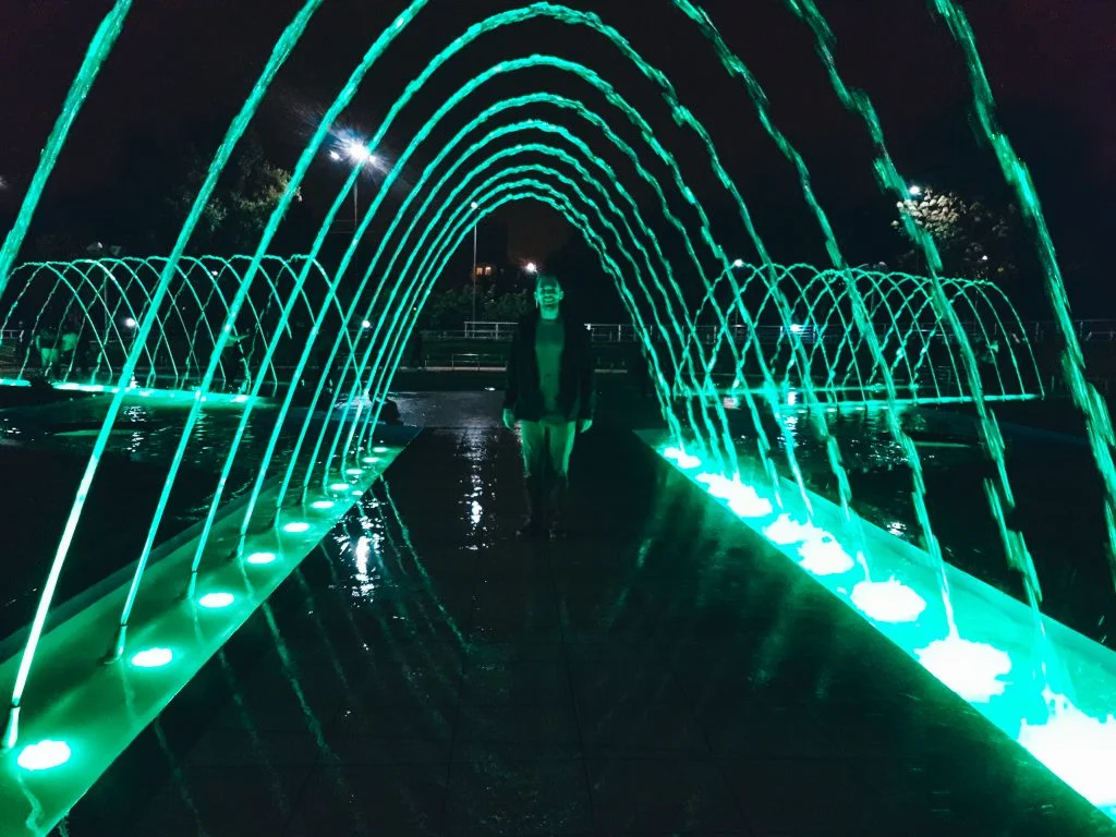 Matt walking through one of the water features at Parque de la Familia