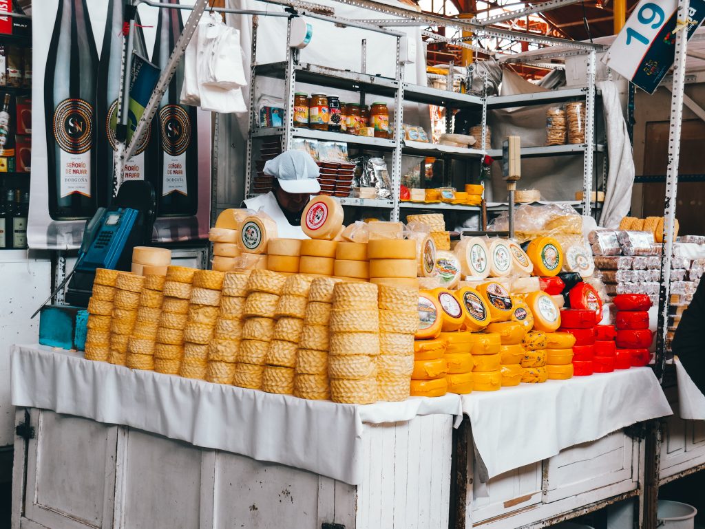 So many cheese wheels and other food options at the local market