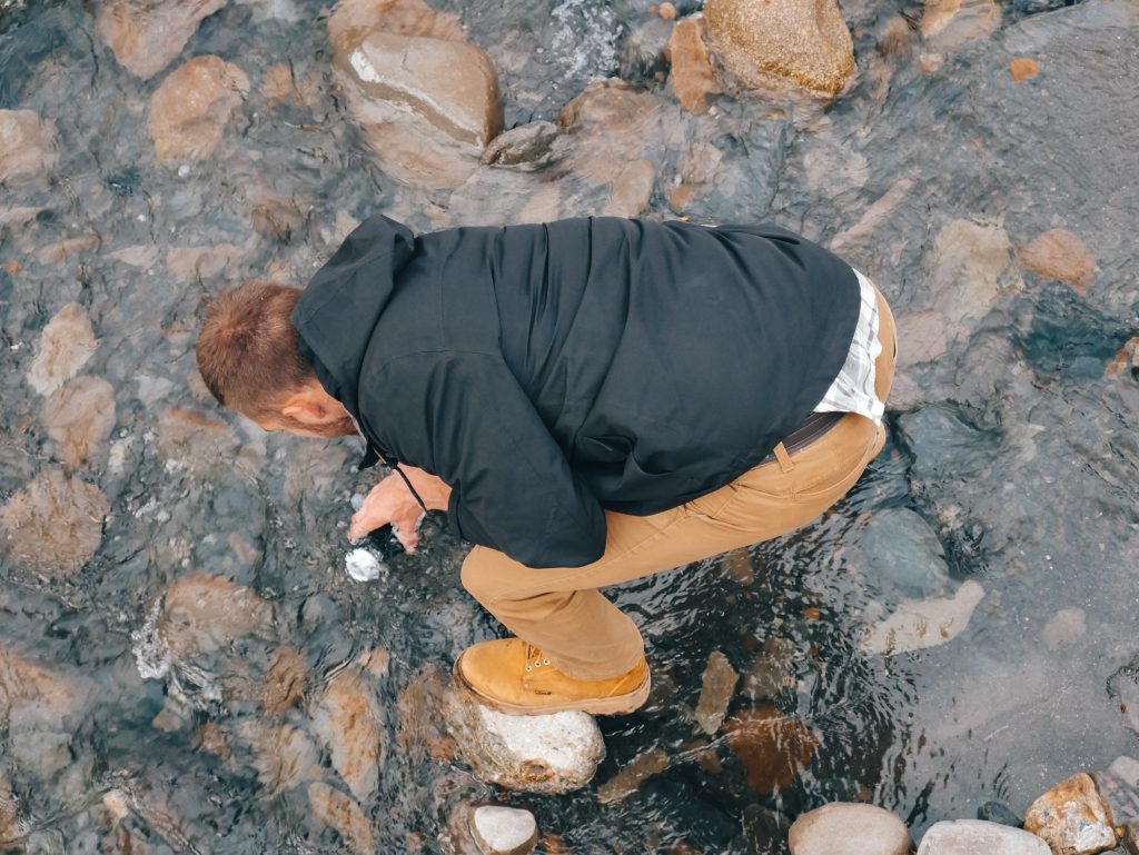 Matt filling our bottle in the river