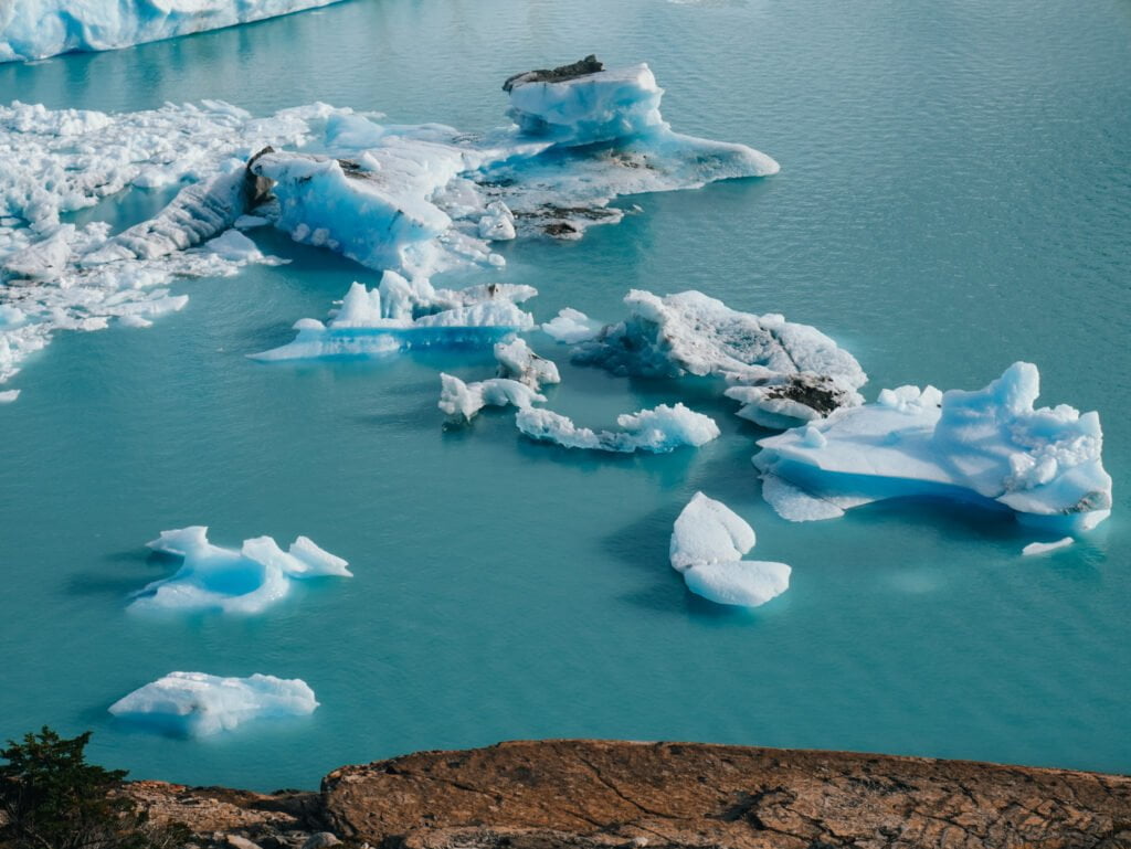 Chunks of ice floating in the azure water