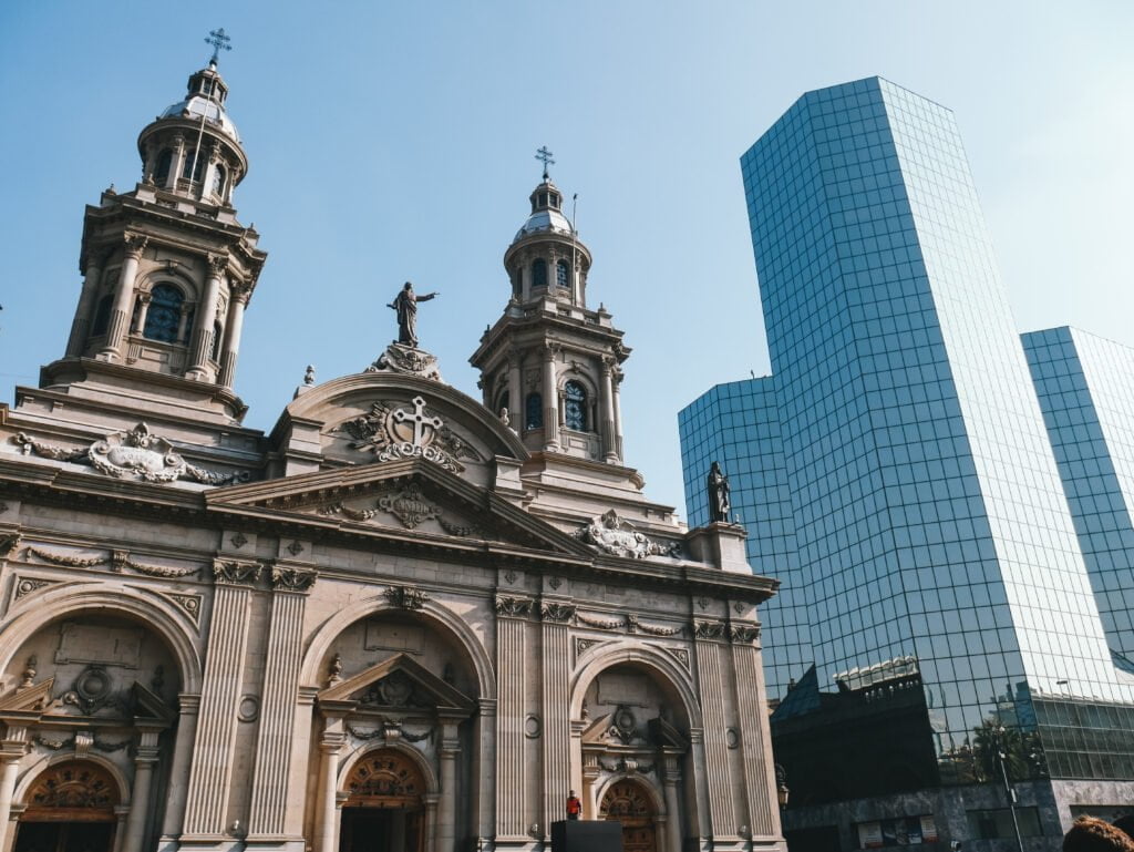 Old colonial architecture near modern skyscrapers at the Plaza de Armas