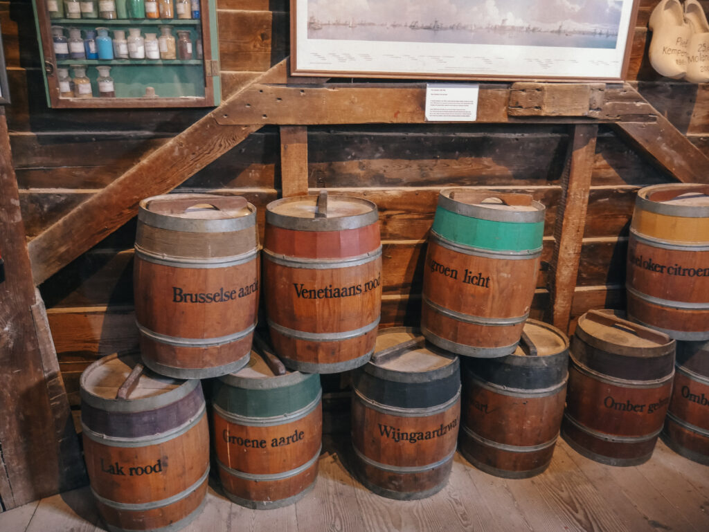 Barrels containing different pigment colors