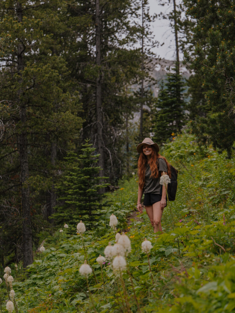 Lia among wildflowers on the West Fork Teton Trail