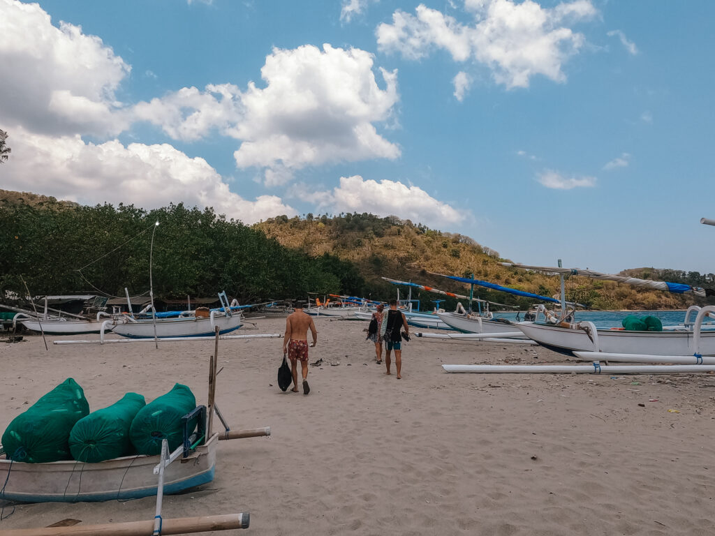 Walking among the boats on the shores of Nipah Beach