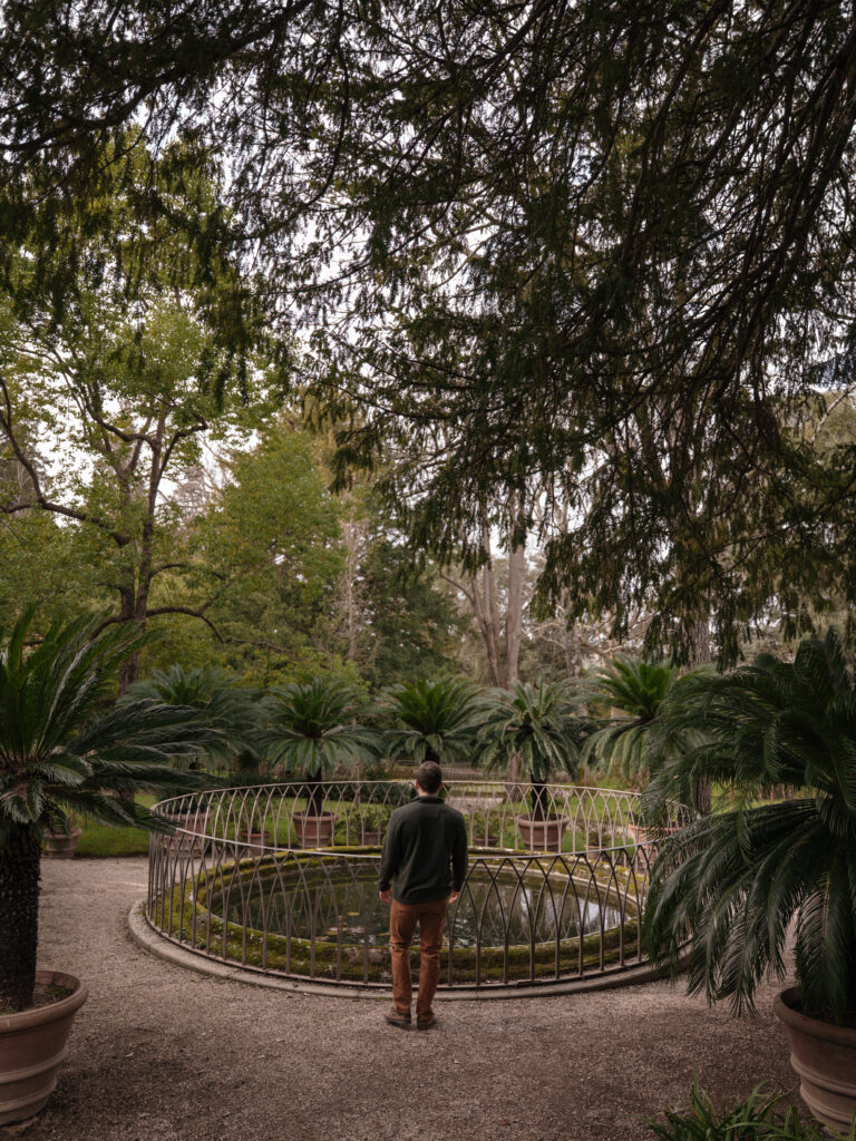 Matt near a fountain in the gardens