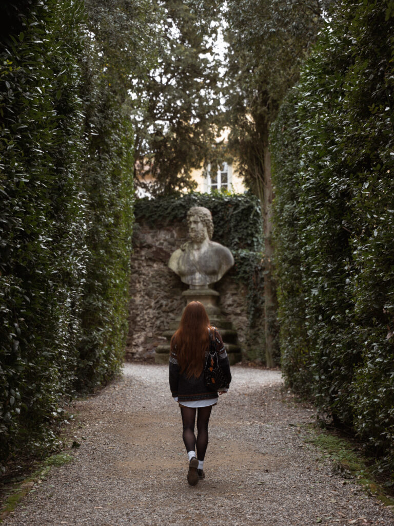 Lia strolling among hedges in the Boboli Gardens