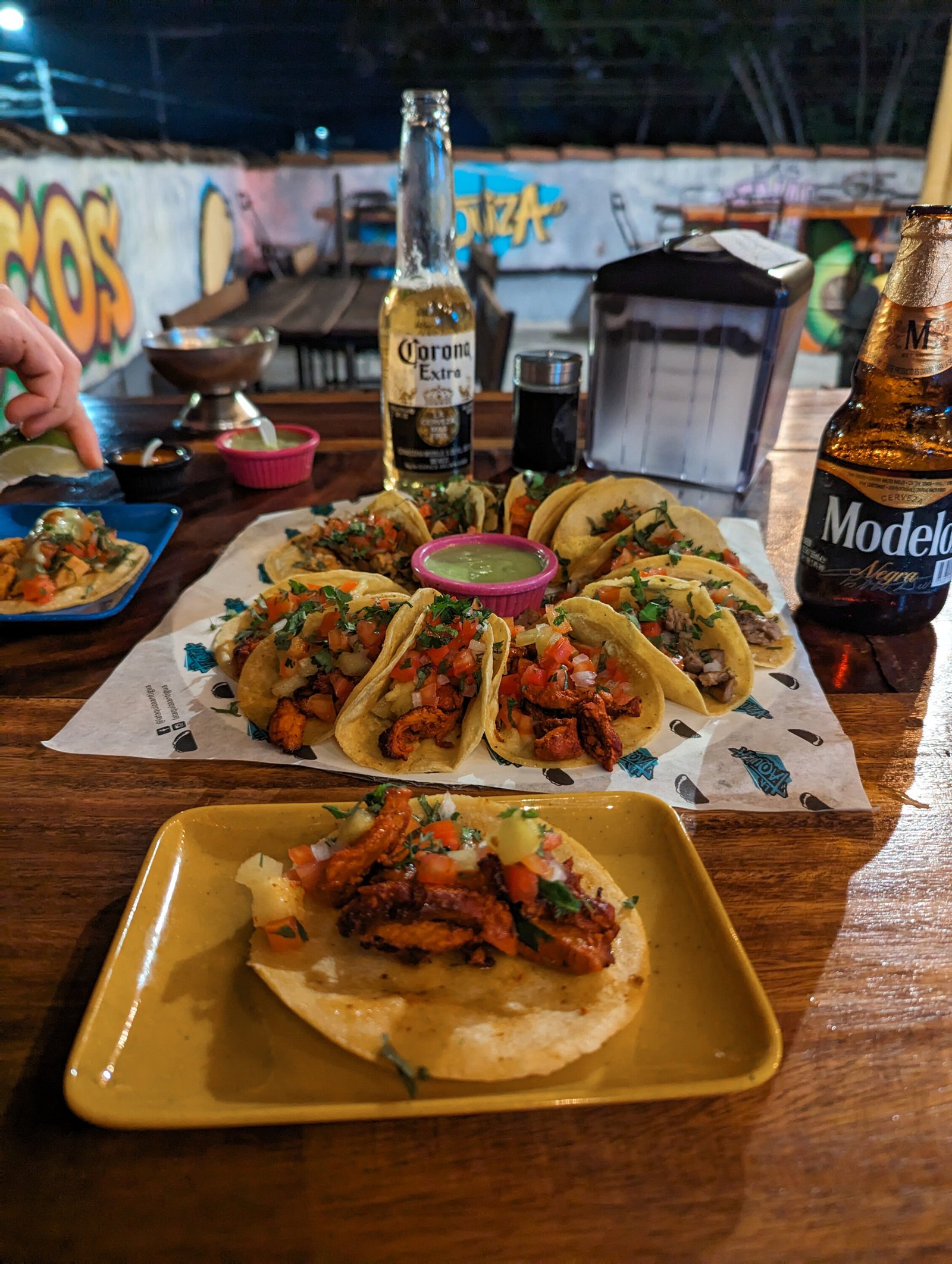 Enjoying tacos and beer on the rooftop of La Taquiza