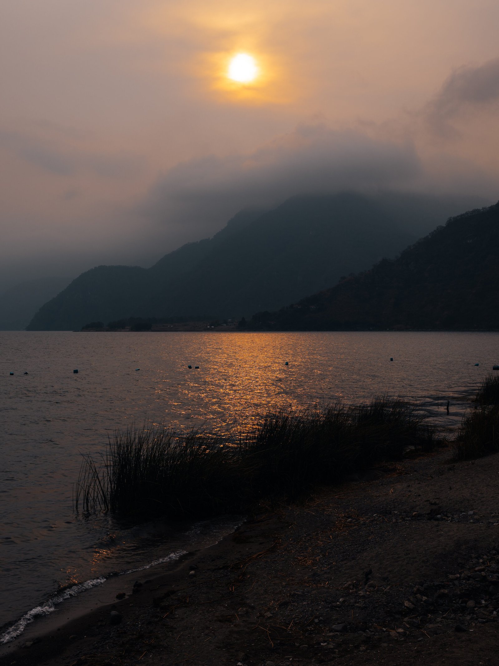 A hazy sunset from the shores of Panajachel