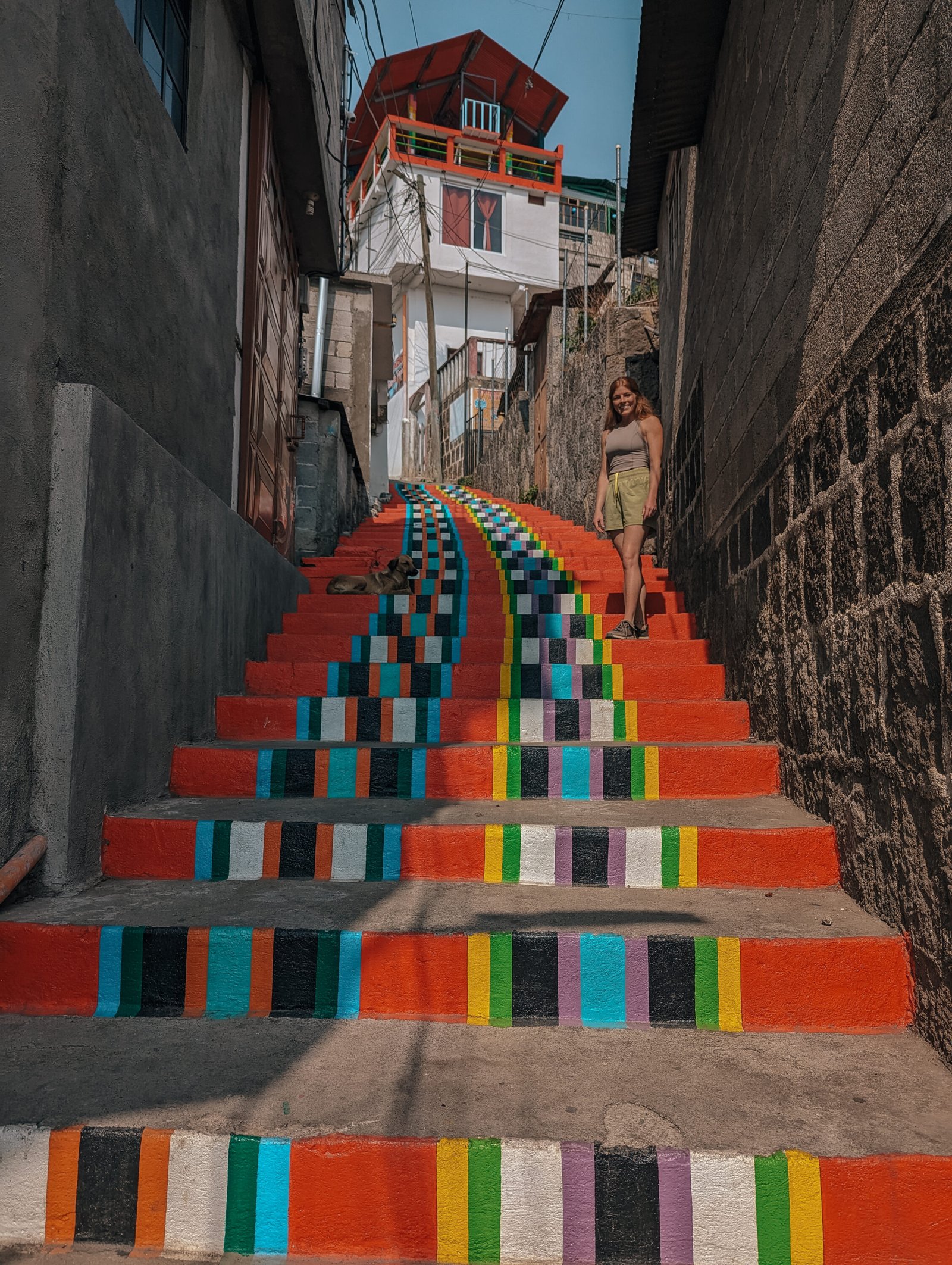 Lia walking up some colorful steps