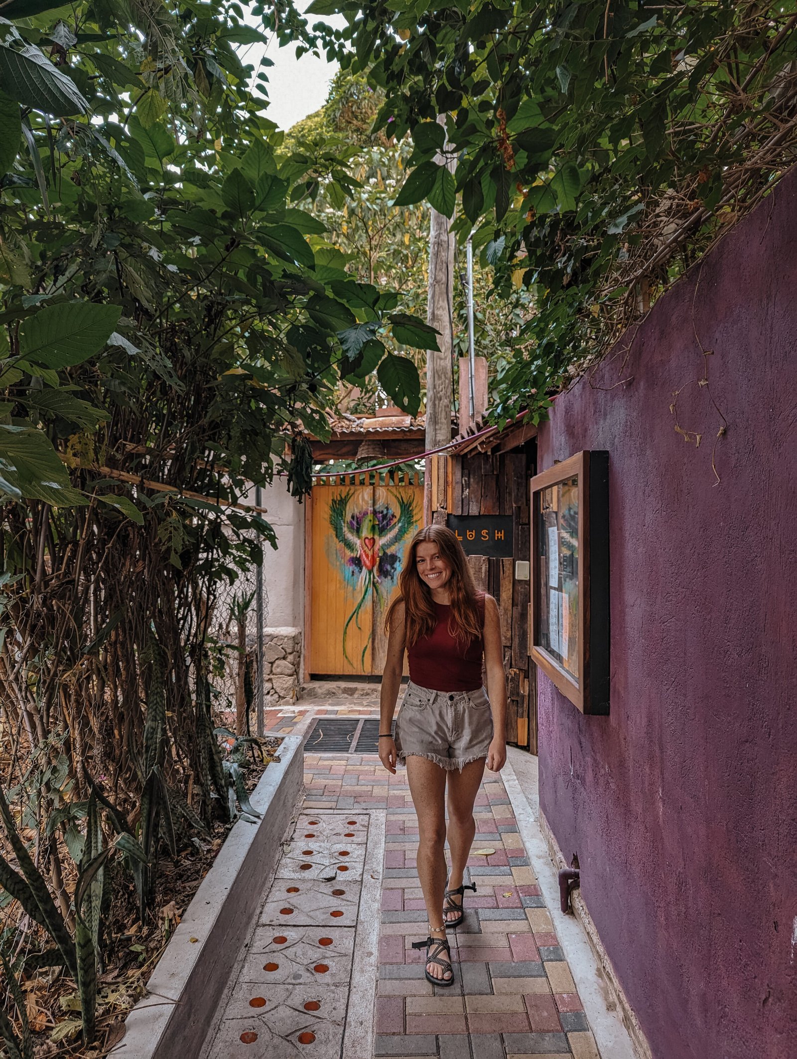 Lia walking down an alley in San Marcos