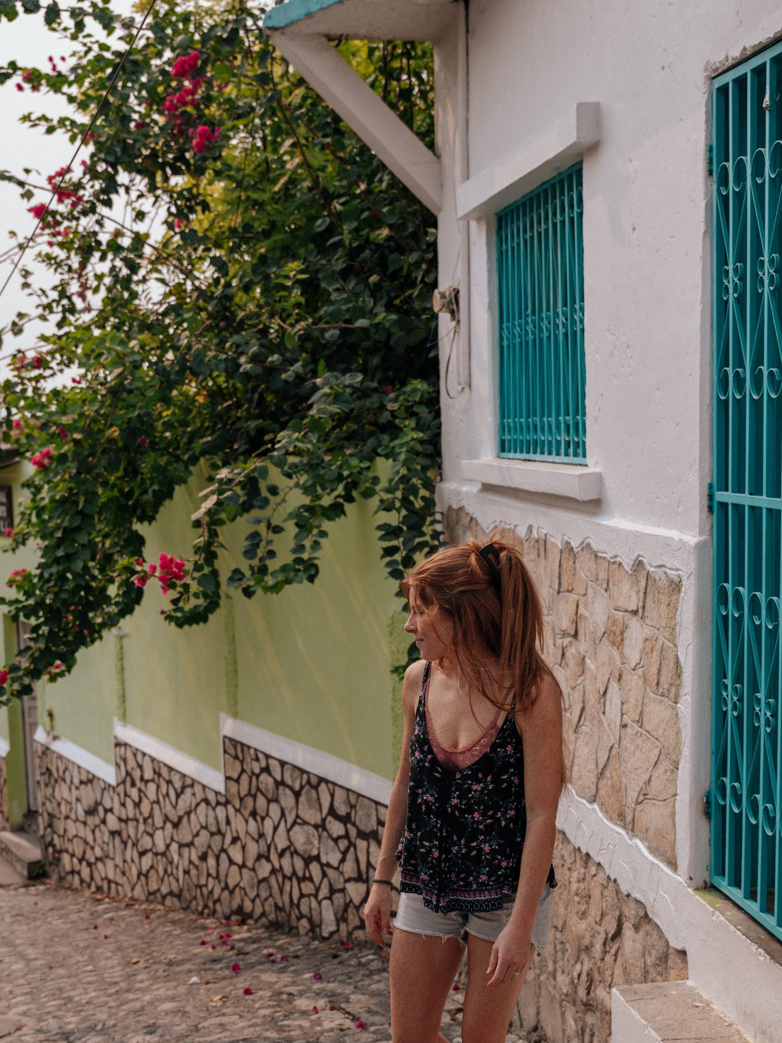 Lia walking down a colorful street