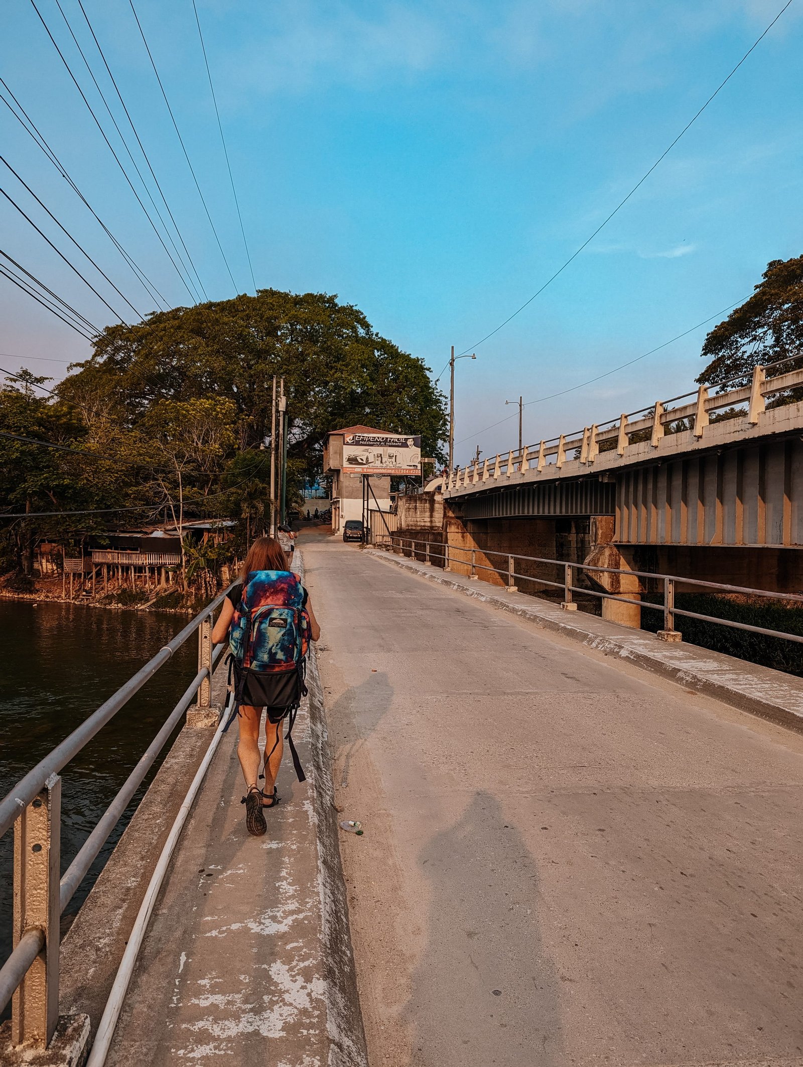 Walking across the bridge towards the Belize-Guatemala border